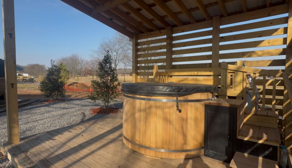 Ferncrest glamping concept featuring a premium hot tub deck representative of the operating partnership