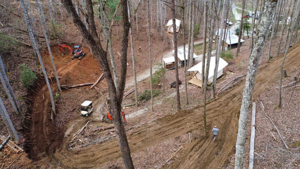 Hillside grading with erosion control matting and equipment on site